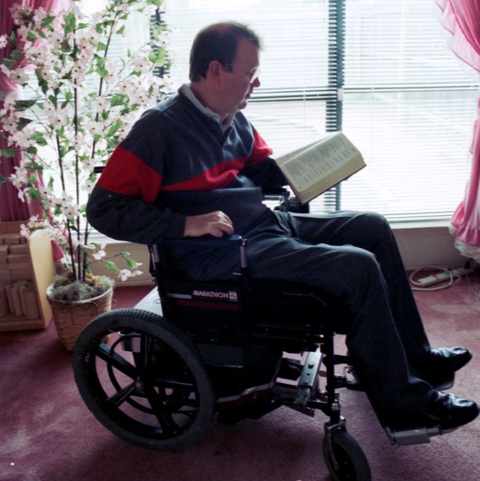 Rev. Robert Sorrels, a quadriplegic, has given up on finding a position as pastor for the Southern Baptist Convention; he takes time out from studying the computer for Bible reading.